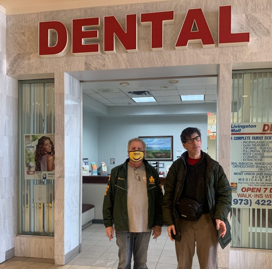 Two Jespy Members In Front Of Dental Clinic